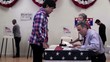 Voters registering to vote at polling place