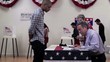 Voters registering to vote at polling place