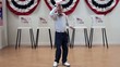 Senior man takes bow and dances in front of voting booths