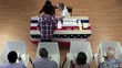 Overhead of voters in voting booths and registration table