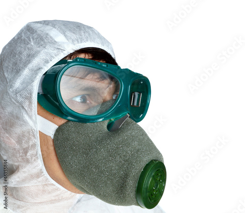 Photo: the man in protective overalls and a respirator the man in protective overalls and a respirator