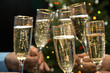 People hands with crystal glasses full of champagne