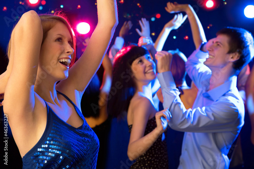 Photo: Beautiful girl dancing at a party Beautiful girl dancing at a party