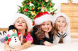Photo: Children in Santa hats Children in Santa hats