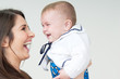 mum and baby laughing together