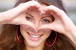 Photo: Young beautiful woman show love sign Young beautiful woman show love sign