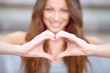 Photo: Young beautiful woman show love sign Young beautiful woman show love sign