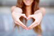 Photo: Young beautiful woman show love sign Young beautiful woman show love sign
