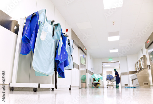 Photo: Hospital corridor with doctor protective uniforms Hospital corridor with doctor protective uniforms
