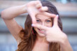 Photo: young beautiful woman making frame with her hands young beautiful woman making frame with her hands