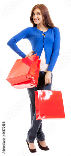 Photo: Cheerful woman with shopping bags, over white Cheerful woman with shopping bags, over white