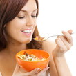 Cheerful woman eating muslin, over white