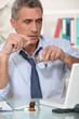 Businessman taking his medication