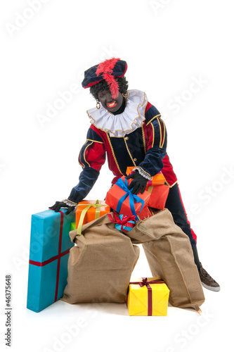 Photo: Dutch black pete with many presents Dutch black pete with many presents