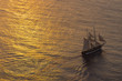 canvas print picture - Ship sailing at sunset