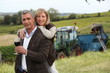 Photo: Couple with wine glass in front of vineyard Couple with wine glass in front of vineyard