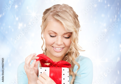 Photo: happy woman with gift box happy woman with gift box