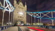 Traffic moving on Tower Bridge in London at night