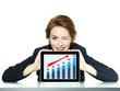 Business woman winking succesful over her tablet pc