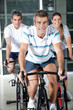 Photo: People On Exercise Bikes People On Exercise Bikes
