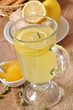 Photo: Healthy ginger tea with lemon and honey on the table Healthy ginger tea with lemon and honey on the table
