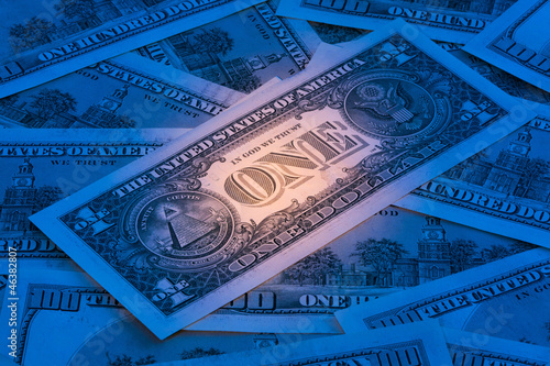 Photo: Background with American dollar bills with mysterious light Background with American dollar bills with mysterious light