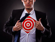 business man showing a target under his shirt