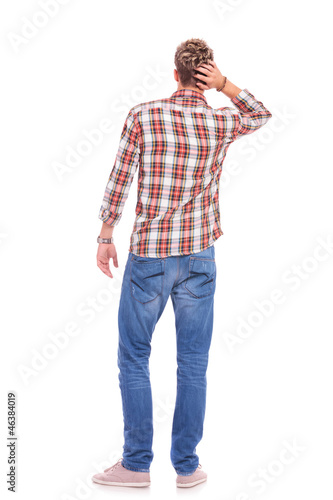 Photo: confused young casual man confused young casual man