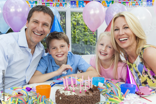 Photo: Family Celebrating Children's Birthday Party With Cake Family Celebrating Children's Birthday Party With Cake