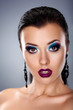Photo: Holiday evening make up. Stylish beauty young woman face Holiday evening make up. Stylish beauty young woman face