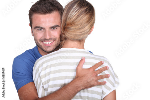 Photo: Man hugging his girlfriend Man hugging his girlfriend