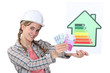 Construction worker with cash and an energy rating card