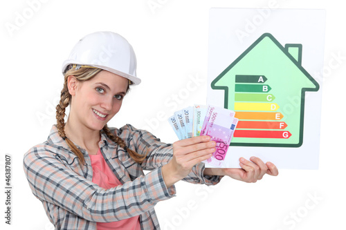 Photo: Construction worker with cash and an energy rating card Construction worker with cash and an energy rating card