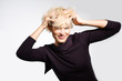 Photo: happy excited woman smiling and messing her hair in the wind happy excited woman smiling and messing her hair in the wind