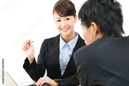 Photo: Young asian smiling businesswoman and businessman Young asian smiling businesswoman and businessman