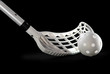 Photo: A silver floorball stick and white ball A silver floorball stick and white ball