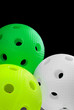 Photo: Three floorball balls isolated on a black background Three floorball balls isolated on a black background