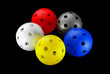Photo: Five floorball balls isolated on a black background Five floorball balls isolated on a black background