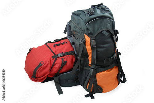Photo: Two used tourist backpacks isolated on white Two used tourist backpacks isolated on white