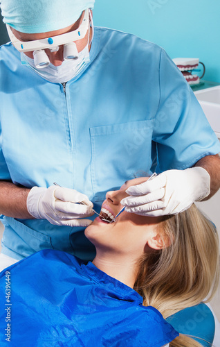 Photo: Photo of a dentist curing a girls teeth Photo of a dentist curing a girls teeth