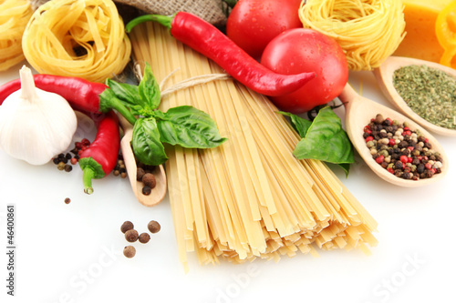 Photo: Pasta spaghetti, vegetables and spices, isolated on white Pasta spaghetti, vegetables and spices, isolated on white