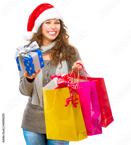 Photo: Christmas Shopping. Woman with Bags over White. Sales Christmas Shopping. Woman with Bags over White. Sales