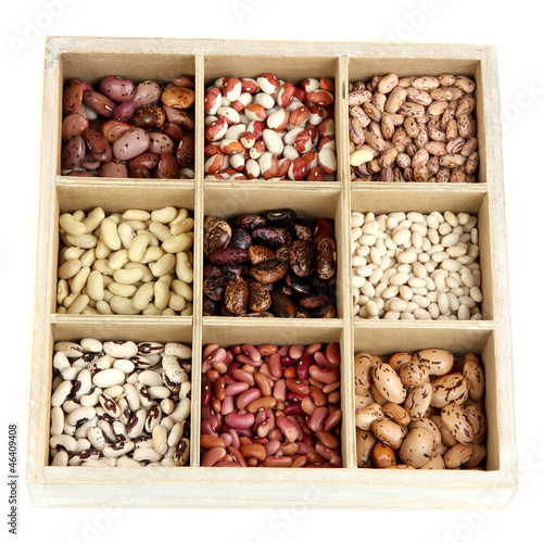 Photo: Diverse beans in wooden box sections isolated on white Diverse beans in wooden box sections isolated on white