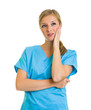 Woman in medical doctor suit isolated on white