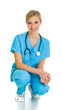Foto: Woman in medical doctor suit isolated on white Woman in medical doctor suit isolated on white