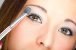 Woman applying eyeshadow