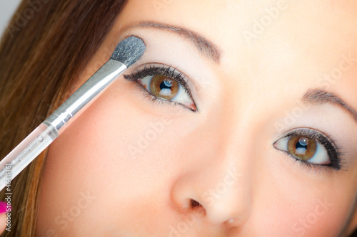 Photo: Woman applying eyeshadow Woman applying eyeshadow