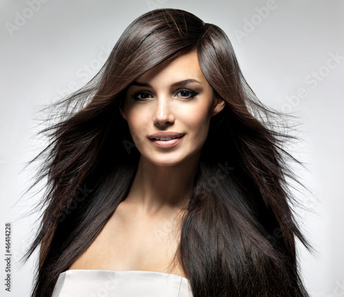 Photo: Fashion model with long straight hair. Fashion model with long straight hair.