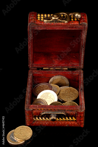 Photo: euro coins isolated on black euro coins isolated on black