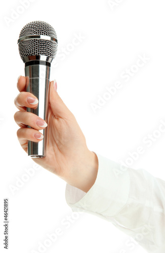 Photo: female hand with microphone isolated on white female hand with microphone isolated on white